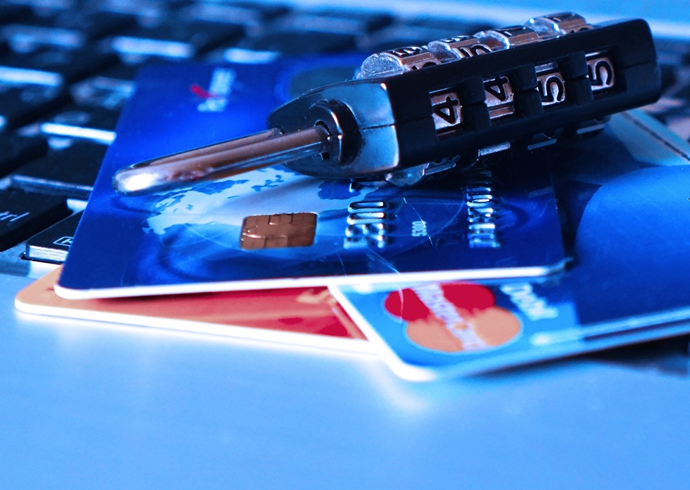 Illustration of a phishing attempt showing a man using a hook to extract information from a software interface