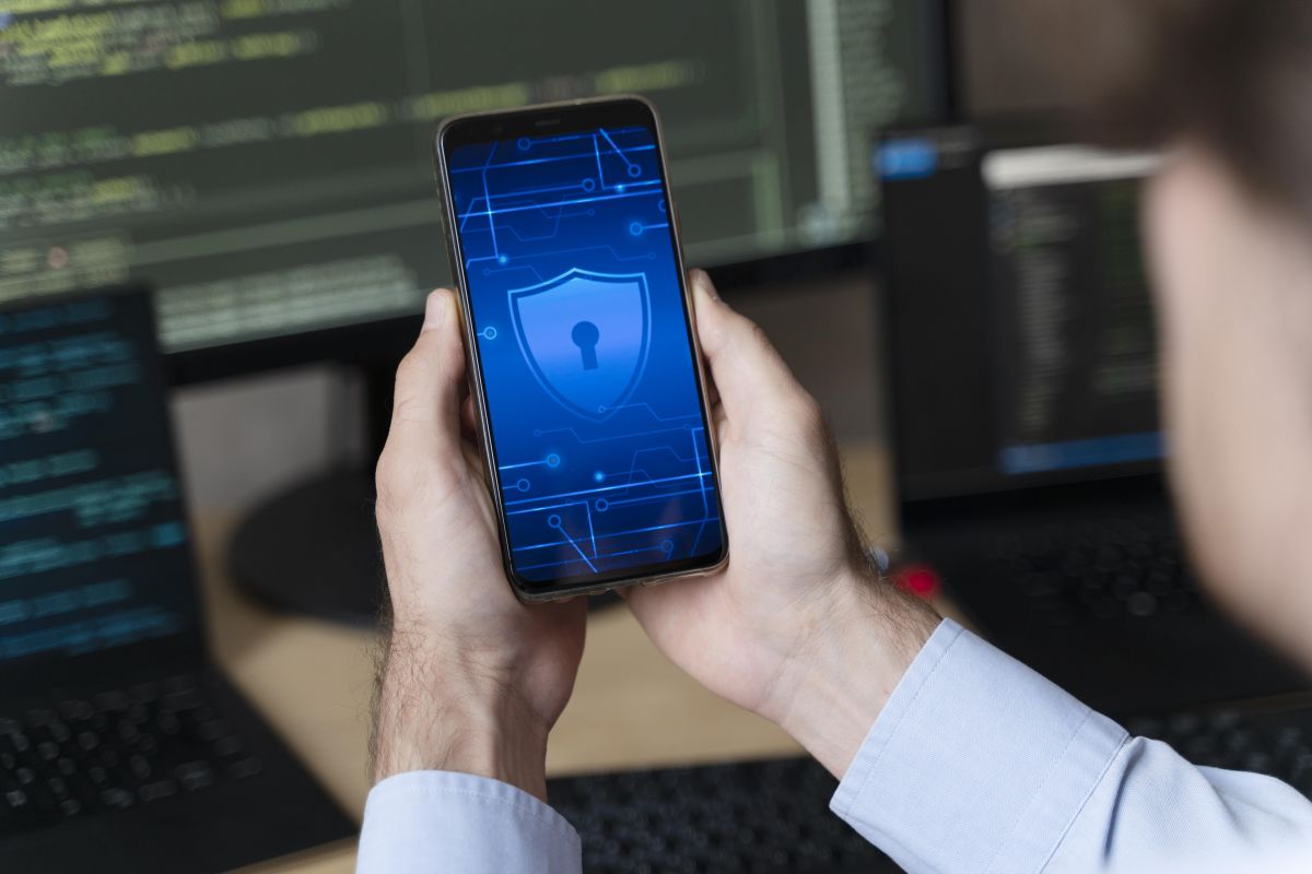 Cybersecurity analyst reviewing application traffic and network activity on monitoring dashboard