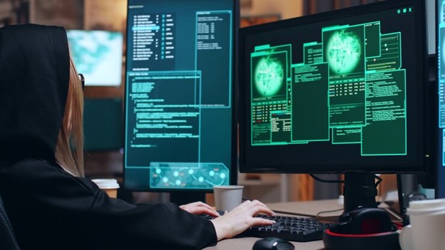 Cybersecurity analyst using network security monitoring solutions and cybersecurity traffic analysis tools to detect and prevent threats in a SOC environment.